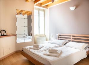 Postel nebo postele na pokoji v ubytování B&B San Rocco