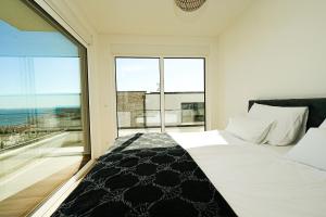 a bedroom with a bed and a large window at Primosten Hills North - Luxury Villa - Sea view in Primošten +41 photos