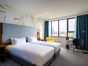 Ліжко або ліжка в номері Mercure Antwerp City Centre