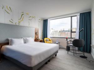 Ліжко або ліжка в номері Mercure Antwerp City Centre