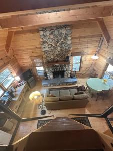 an overhead view of a living room with a stone fireplace at Apple Valley Cabin in Sonora