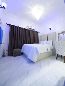 Postel nebo postele na pokoji v ubytování REGNO Apartment