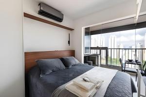 Ένα ή περισσότερα κρεβάτια σε δωμάτιο στο Conforto e vista do 17º andar | A/C e Wi-Fi 500Mb +37 φωτογραφίες