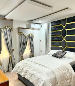 Postel nebo postele na pokoji v ubytování SEATWORK APARTMENT Enugu + 6 fotografií