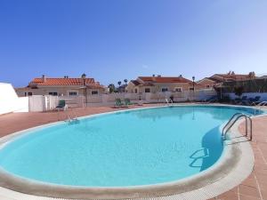 a large swimming pool in the middle of a house at Villa Stay & Enjoy in Antigua
