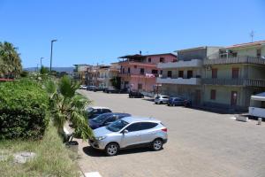 a couple of cars parked in a parking lot at Casa di Agata in Torrenova