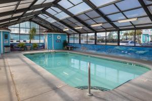 a large swimming pool with a glass ceiling at 0210 Sun-Kissed Memories condo in Carolina Beach