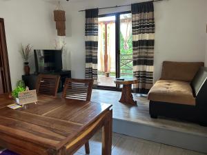 a living room with a couch and a table at blue angel 3 in Playa del Carmen