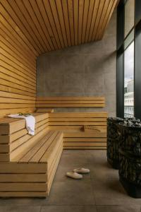 a sauna with a bench in a room at Hôtel Monroe - Downtown Montreal in Montreal