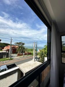 a view of a street from a window of a building at Beach House Delegado Marcio in Balneário Camboriú