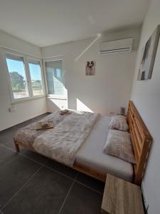 Postel nebo postele na pokoji v ubytování Apartman M & M, Schöne Wohnung nur 200m vom Strand