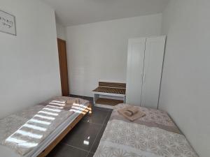Postel nebo postele na pokoji v ubytování Apartman M & M, Schöne Wohnung nur 200m vom Strand