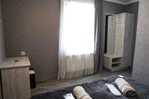Rúm í herbergi á Hotel Elia Kazbegi