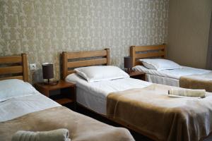 Rúm í herbergi á Hotel Elia Kazbegi