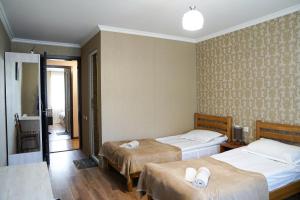 Rúm í herbergi á Hotel Elia Kazbegi