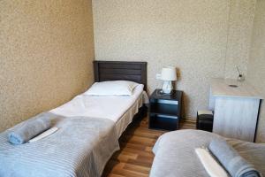 Rúm í herbergi á Hotel Elia Kazbegi
