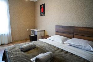 Postel nebo postele na pokoji v ubytování Hotel Elia Kazbegi