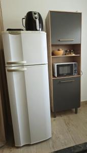 Kuchyň nebo kuchyňský kout v ubytování Loft Novo Completo Super EQUIPADO