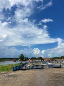 a view of a body of water with a cloudy sky at Hotel Torre Forte in Careiro