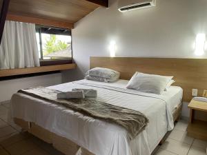 Ένα ή περισσότερα κρεβάτια σε δωμάτιο στο Beach Class Muro Alto by AFT +41 φωτογραφίες