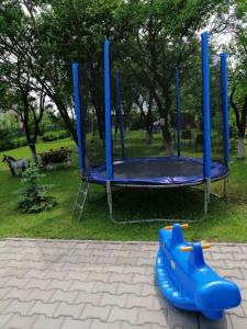 a blue playset in a park with a playground at Mobile Home CARMINO in Turda