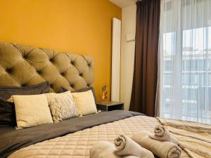 Ένα ή περισσότερα κρεβάτια σε δωμάτιο στο CityLightsEuroveaTower