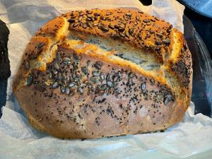 a loaf of bread with seeds on top at SEA & LAKE VIEW VILLA in (( Kalive Gjoka ))