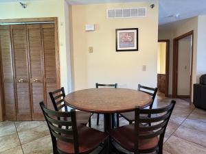 a dining room with a table and chairs at Put-in-Bay Poolview Condo #5 in Put-in-Bay