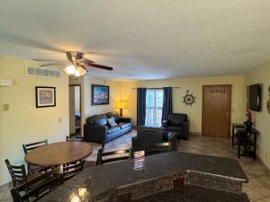 a living room with a couch and a table at Put-in-Bay Poolview Condo #5 in Put-in-Bay