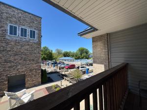 a balcony with a view of a parking lot at Put-in-Bay Poolview Condo #5 in Put-in-Bay