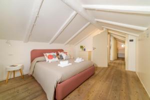a bedroom with a large bed in a attic at Casa di Zia Rosaria SEA VIEW in Vietri sul Mare