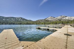 a dock on a lake with mountains in the background at Cozy Deluxe Studio #131 at Donner Lake Village condo in Truckee +6 photos