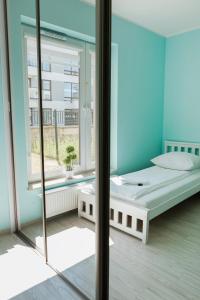 Ένα ή περισσότερα κρεβάτια σε δωμάτιο στο Apartament Cyrkoniowa