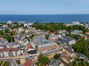 an aerial view of a city with the ocean at Baltic Waves Resort & Wellness I Where the Baltic Meets Luxury in Międzyzdroje