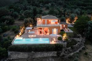 an aerial view of a house with a swimming pool at Kronos Estate Lefkada - 5 star luxury in Mikros Gialos