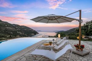 a pool with white chairs and an umbrella at Kronos Estate Lefkada - 5 star luxury in Mikros Gialos