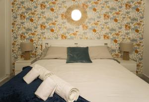 En eller flere senge i et værelse på Playa San Juan Costa Relax