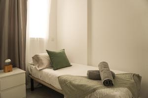 En eller flere senge i et værelse på Playa San Juan Costa Relax