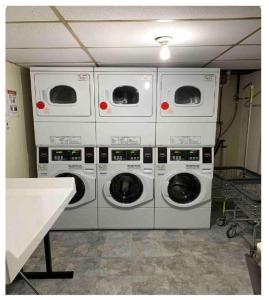 four washing machines stacked on top of each other in a room at Hudson Guest House in Jersey City +44 photos