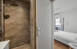 a bathroom with a shower with a glass door at 1 Bedroom Beautiful Apartment In Vodice in Vodice