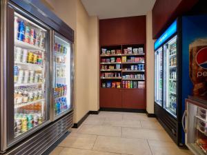 an aisle of a store with two refrigerators at Courtyard Culver City Los Angeles in Los Angeles