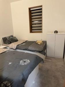 Primo apartmani客房内的一张或多张床位