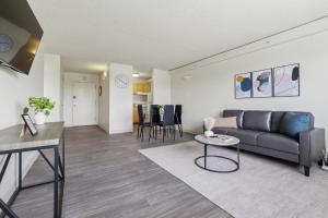 a living room with a couch and a table at Legacy At Imperial Village 712 I 1 Bed 1 Bath in Richmond