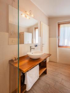 a bathroom with a sink and a mirror at La Fontanina in Vobarno