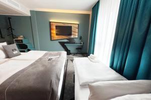 Ένα ή περισσότερα κρεβάτια σε δωμάτιο στο Holiday Inn - the niu, Flash Berlin Charlottenburg by IHG