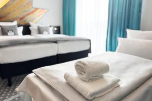 Ένα ή περισσότερα κρεβάτια σε δωμάτιο στο Holiday Inn - the niu, Flash Berlin Charlottenburg by IHG