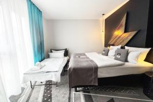 Ένα ή περισσότερα κρεβάτια σε δωμάτιο στο Holiday Inn - the niu, Flash Berlin Charlottenburg by IHG