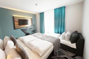 Ένα ή περισσότερα κρεβάτια σε δωμάτιο στο Holiday Inn - the niu, Flash Berlin Charlottenburg by IHG