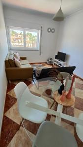a living room with a couch and a table at Li-miana Alojamento Local in Ponte de Lima
