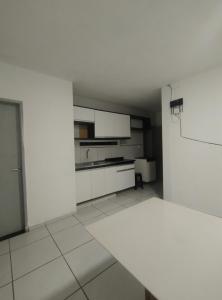 Kuchyň nebo kuchyňský kout v ubytování Apartamento temporada